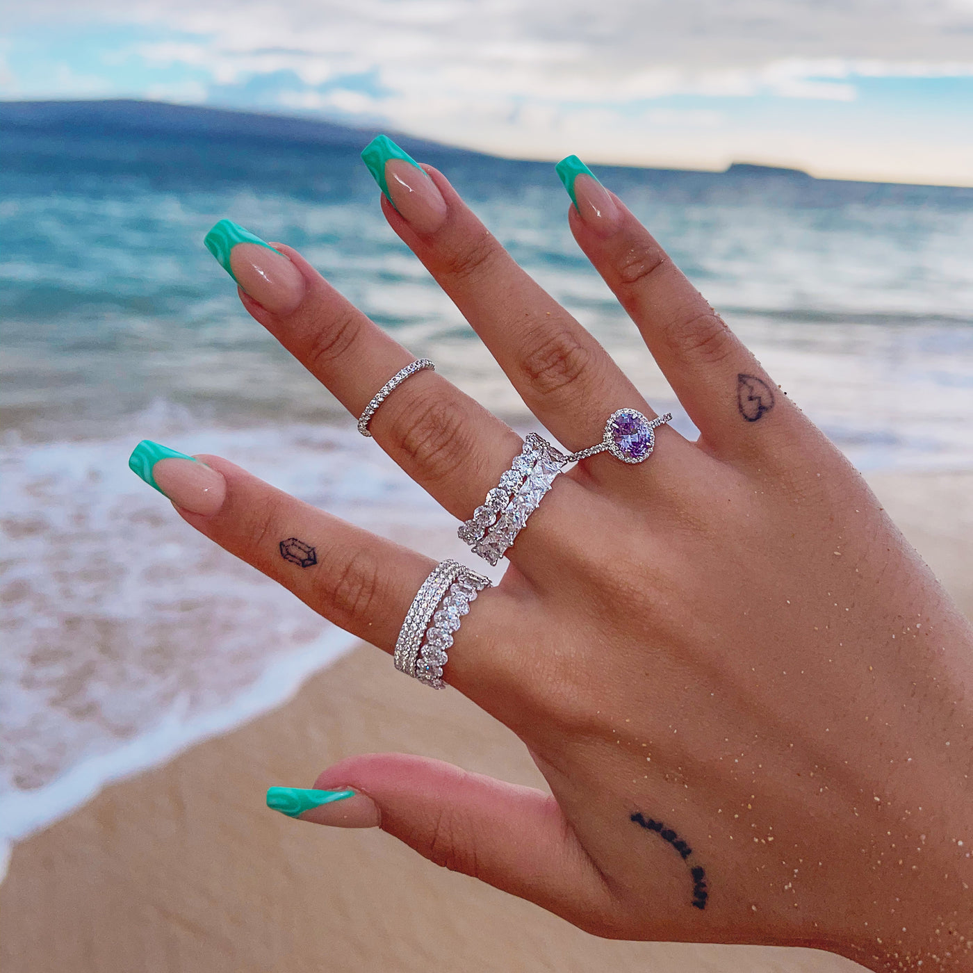 2 SIZE 5 SILVER RINGS SS